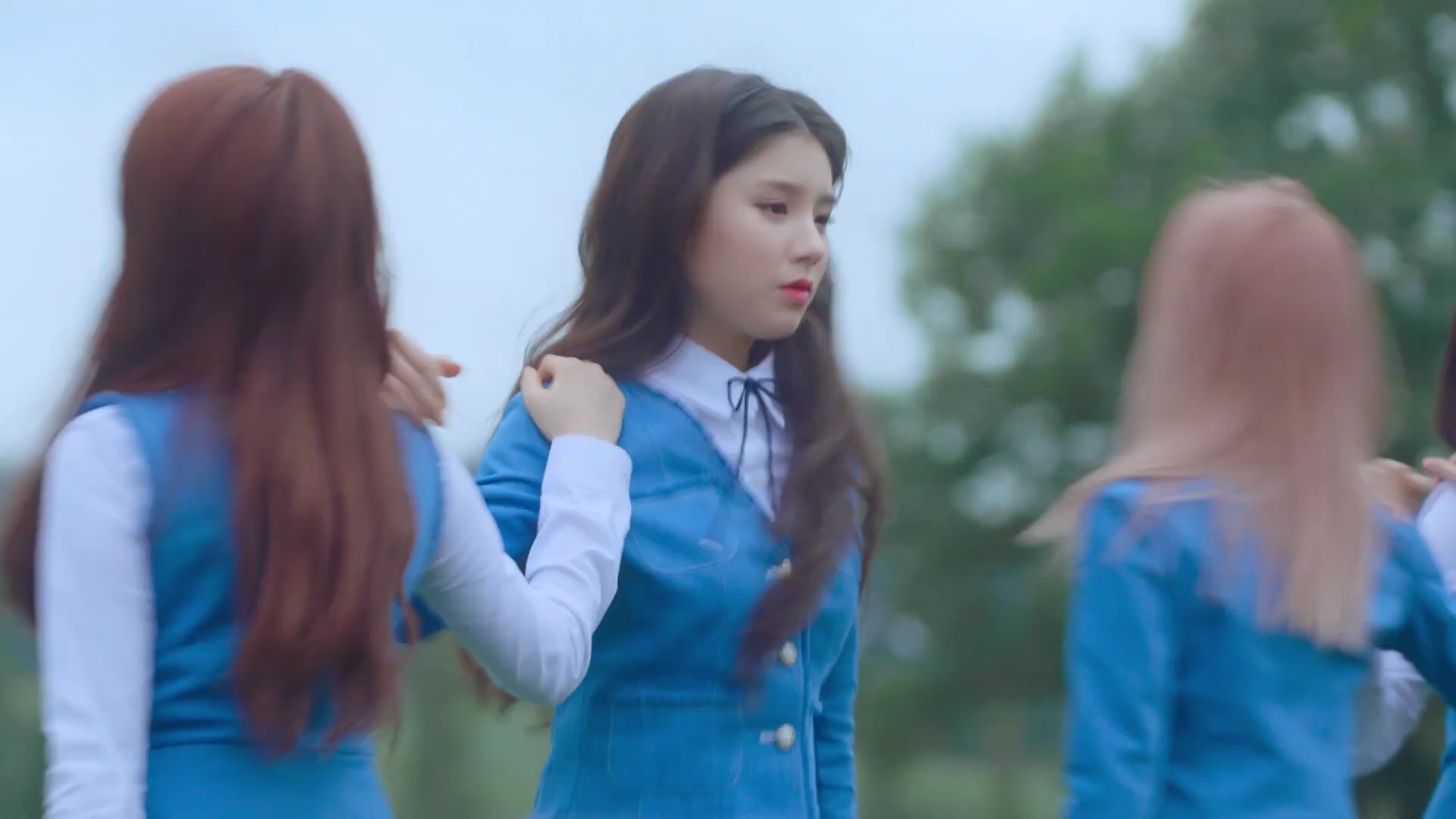 Loona One Third dancing in a field.